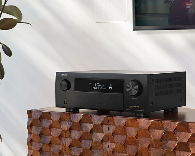 Denon AV Receiver on an entertainment console