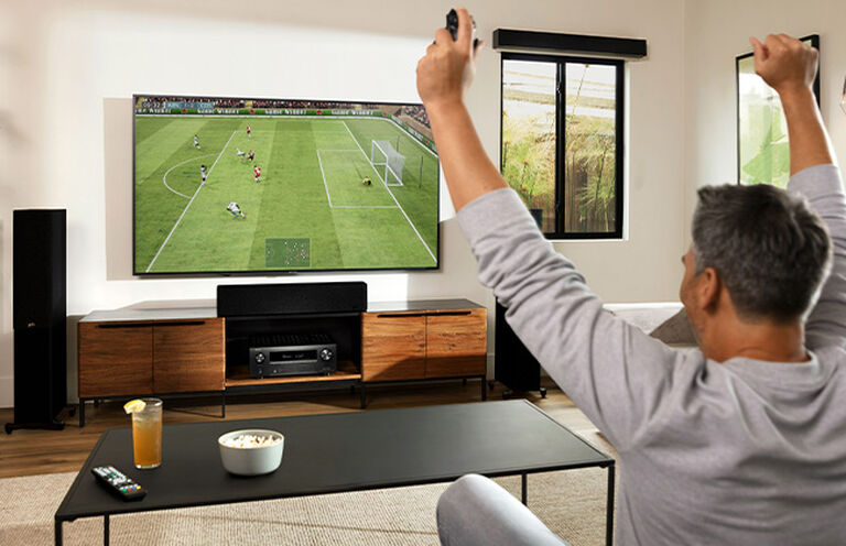 A man watching TV A man watching TV