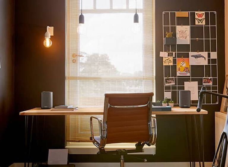 A desk with Denon Home speakers A desk with Denon Home speakers