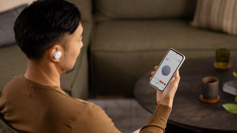 A  man looking at his sound profile